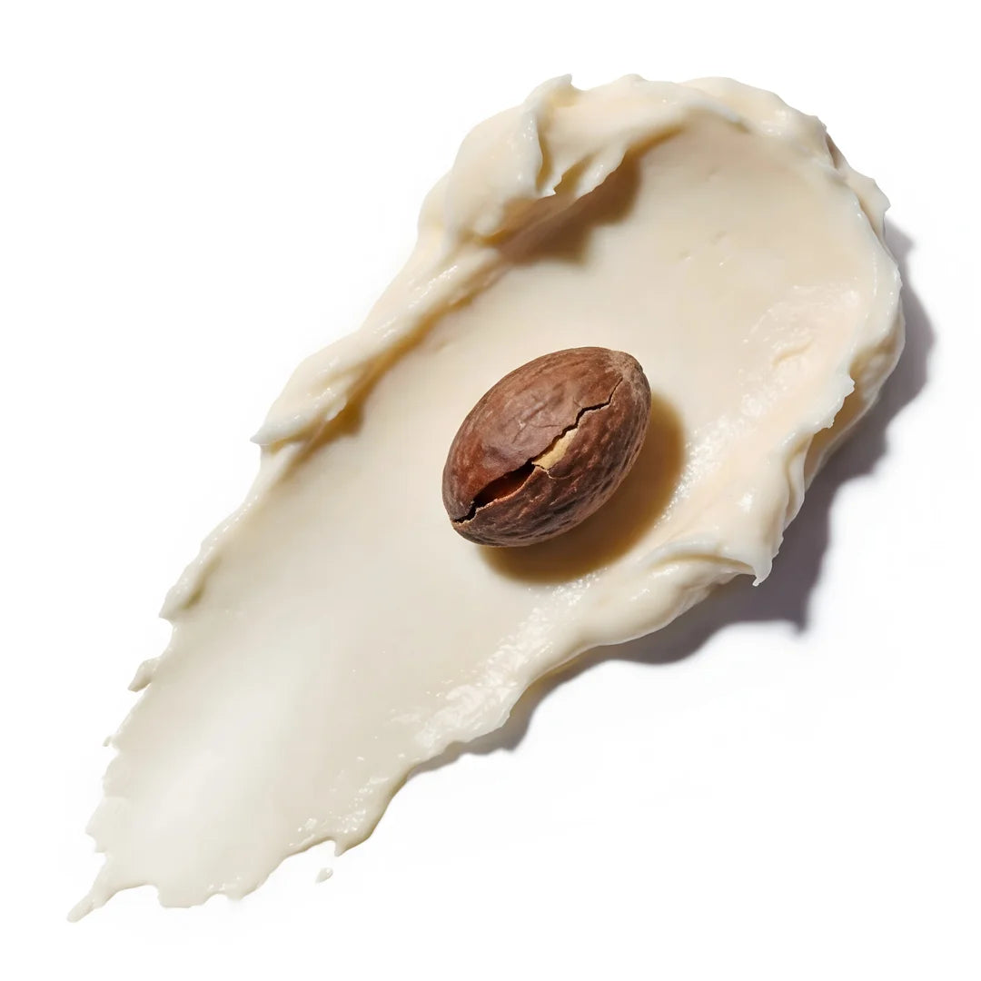 Creamy shea butter swipe with a cracked shea nut on a clean white background, representing Yelf Clean Affairs Cleansing Milk