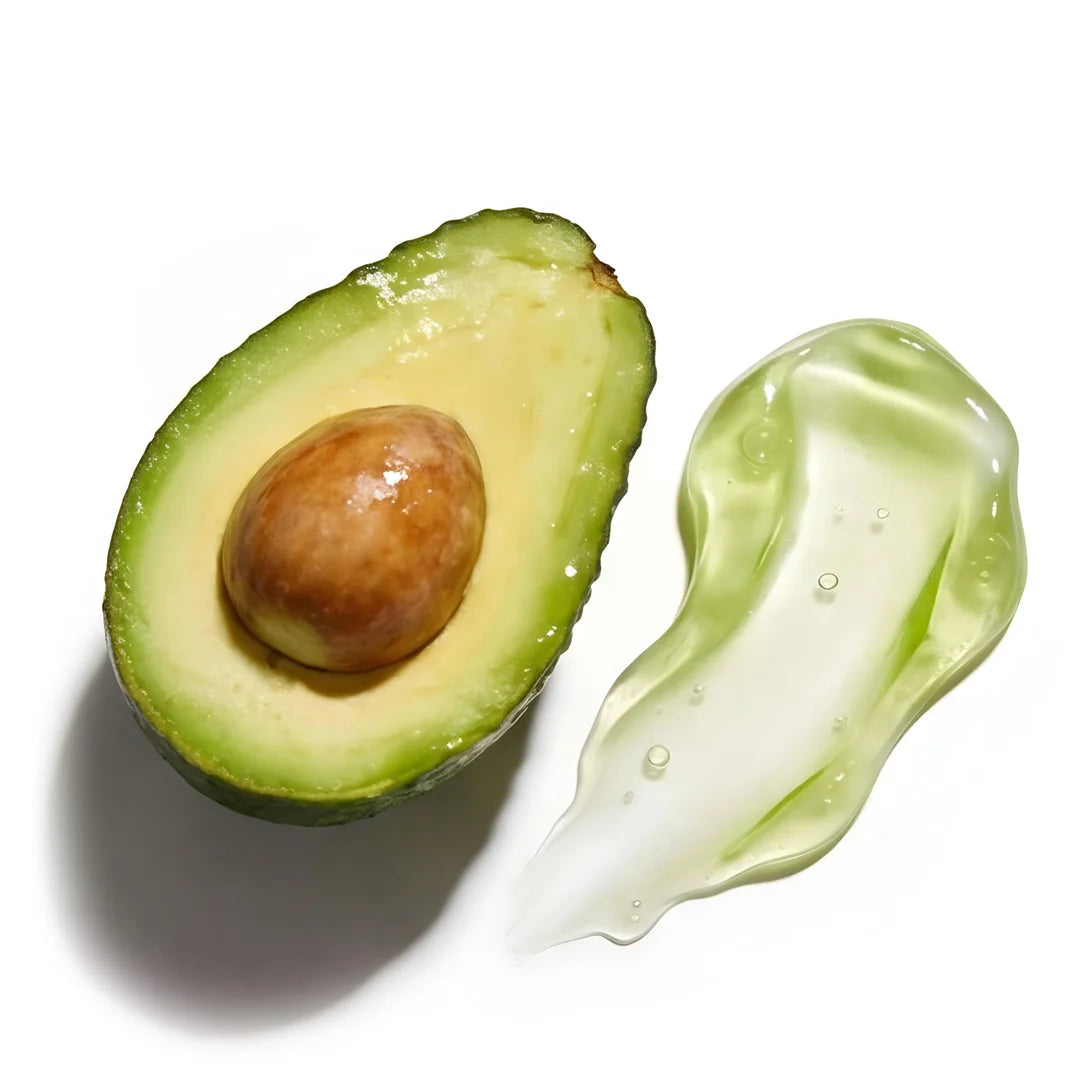 Top view of aloe vera gel texture with air bubbles next to a fresh avocado half, highlighting hydration and nourishing skincare ingredients