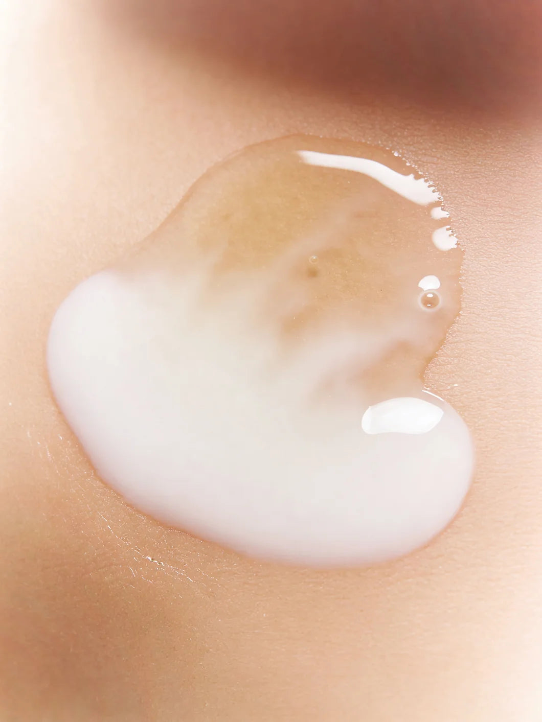 Yelf Clean Affairs Oil-to-Milk Cleanser texture transforming from transparent gel-like oil into a milky fluid on smooth skin surface
