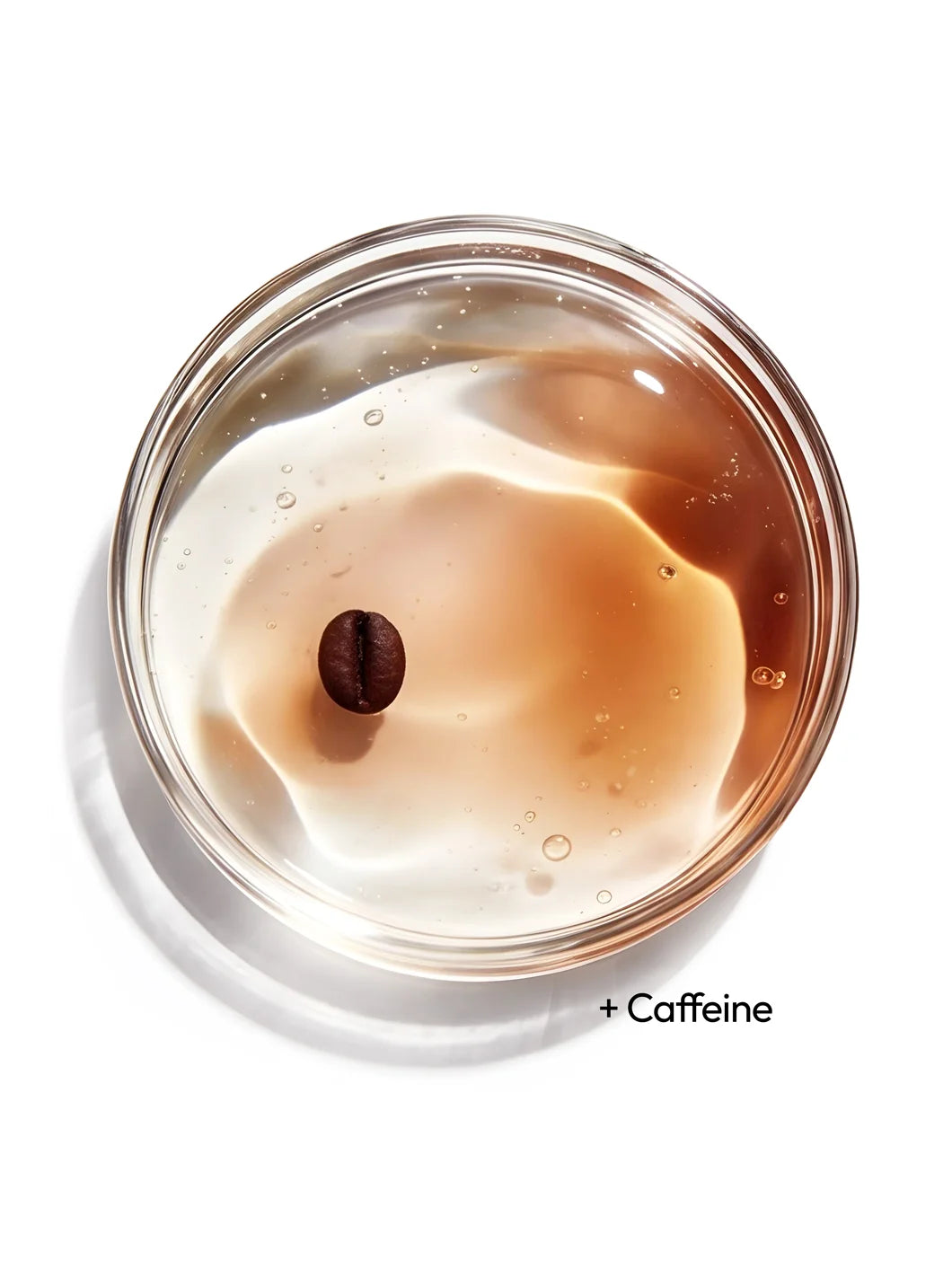 Top view of caffeine in a clear gel with fine bubbles inside a petri dish, representing energising and de-puffing effects in Yelf Viva el Boost Caffeine Gel