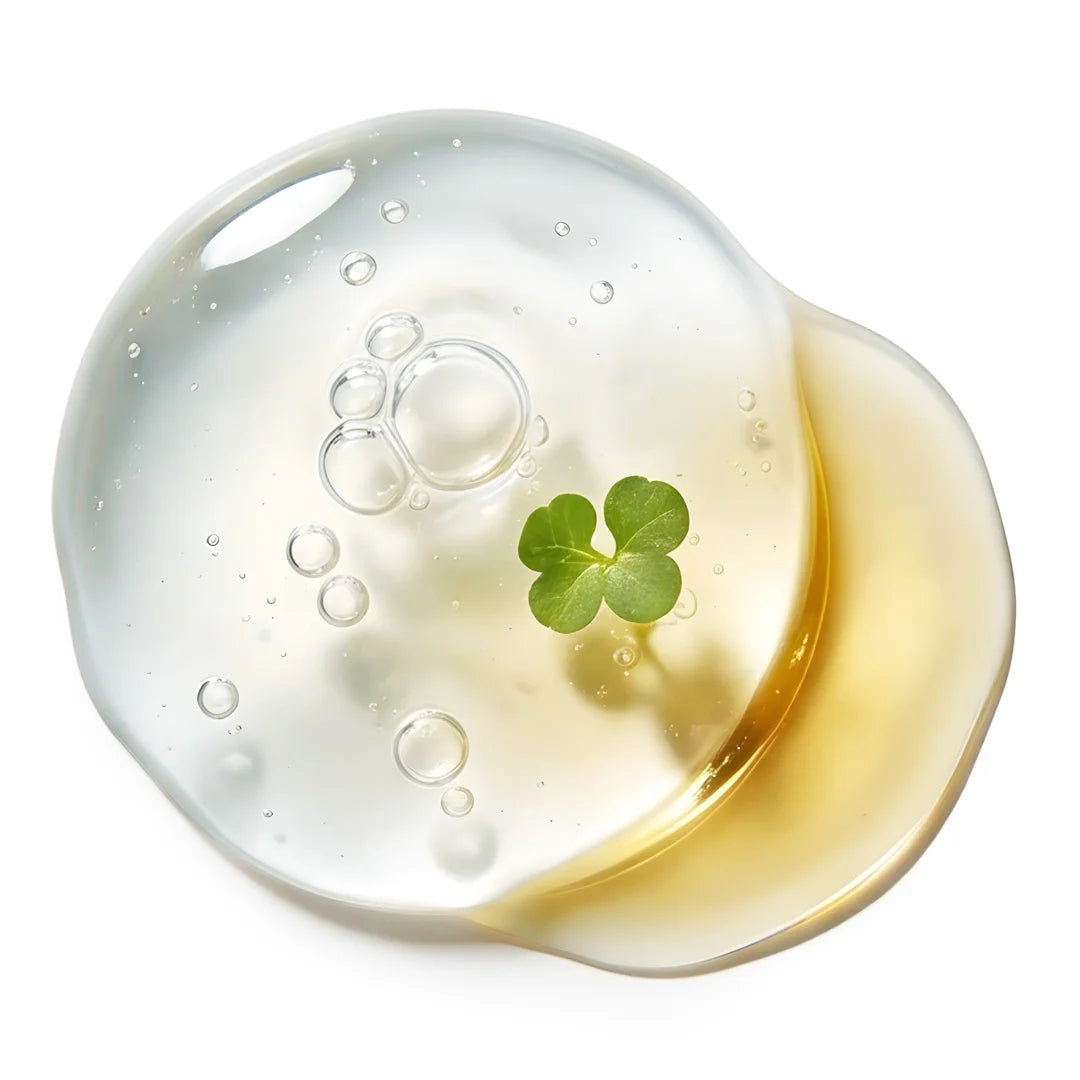 Thin translucent gel with adjacent sunflower oil and watercress leaf on clean white background, top view representing Yelf Viva el Boost Collagen Serum.